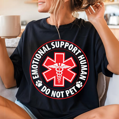 May include: Black t-shirt with a red circle and white text that reads "Emotional Support Human Do Not Pet". Inside the circle is a red medical symbol with a snake and wings.