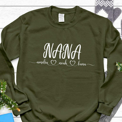 May include: A green sweatshirt with the word "NANA" in white lettering. Below the word "NANA" are the names "amelia", "noah", and "luna" with a heart symbol between each name.