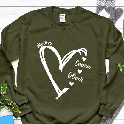 May include: Olive green sweatshirt with a white heart design and the text "Mother" at the top, "Emma" below the heart, and "Oliver" below Emma. There are small hearts next to each name.