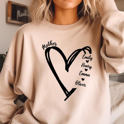 May include: A beige sweatshirt with a black heart design and the word "Mother" above it. Inside the heart are the names "Emily", "Henry", "Emma", and "Oliver" with a small heart symbol next to each name.