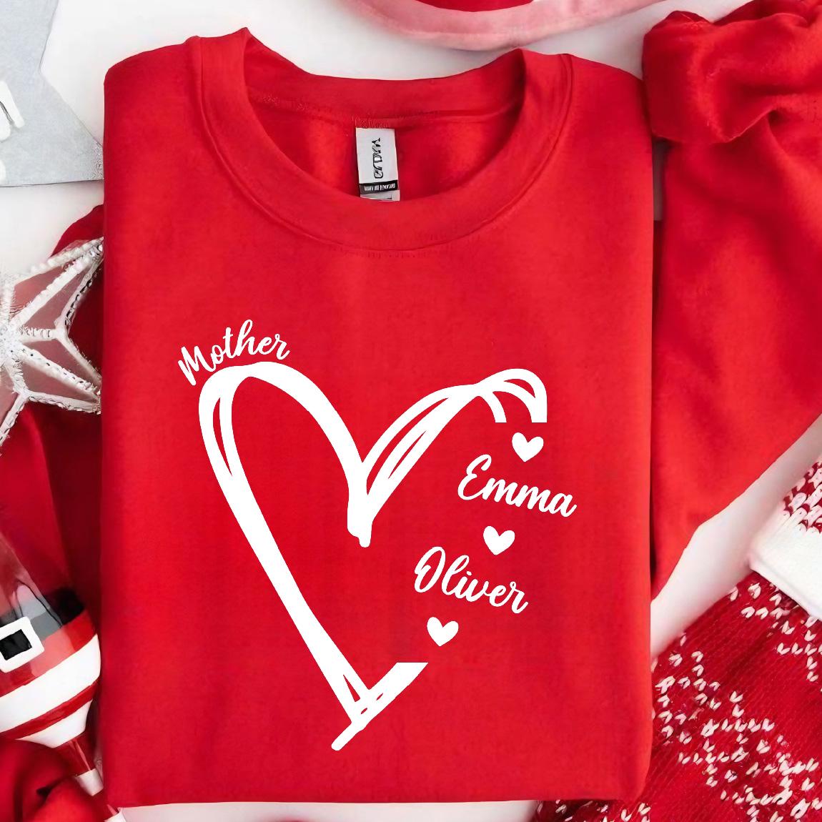 May include: Red sweatshirt with a white heart design and the words "Mother", "Emma", and "Oliver" inside the heart.