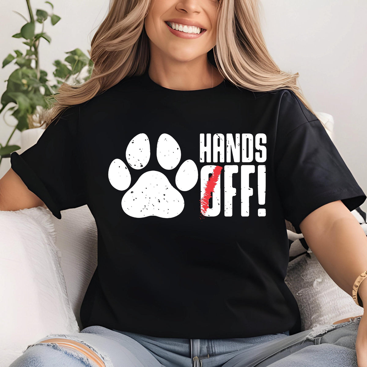 May include: Black t-shirt with a white paw print and the text "HANDS OFF!" in white letters with a red slash through the "O".