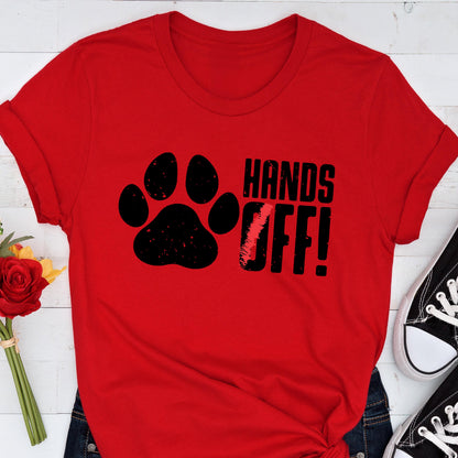 May include: Red t-shirt with a black paw print and the text "HANDS OFF!" in black.