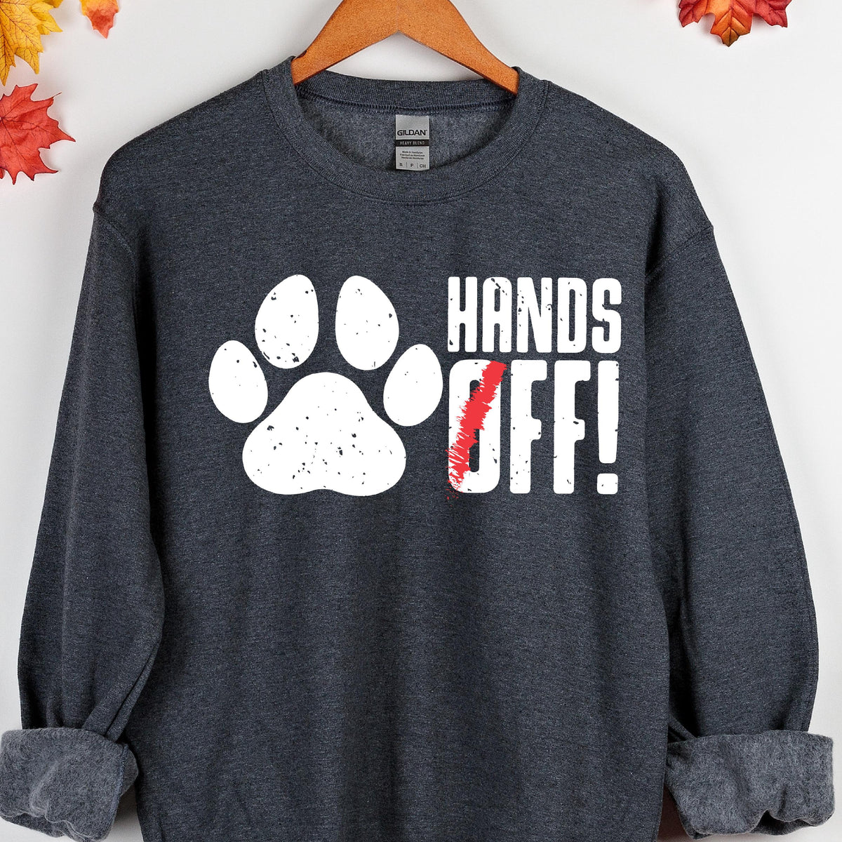 May include: A dark gray sweatshirt with a white paw print and the text "HANDS OFF!" in white letters with a red slash through the "O".