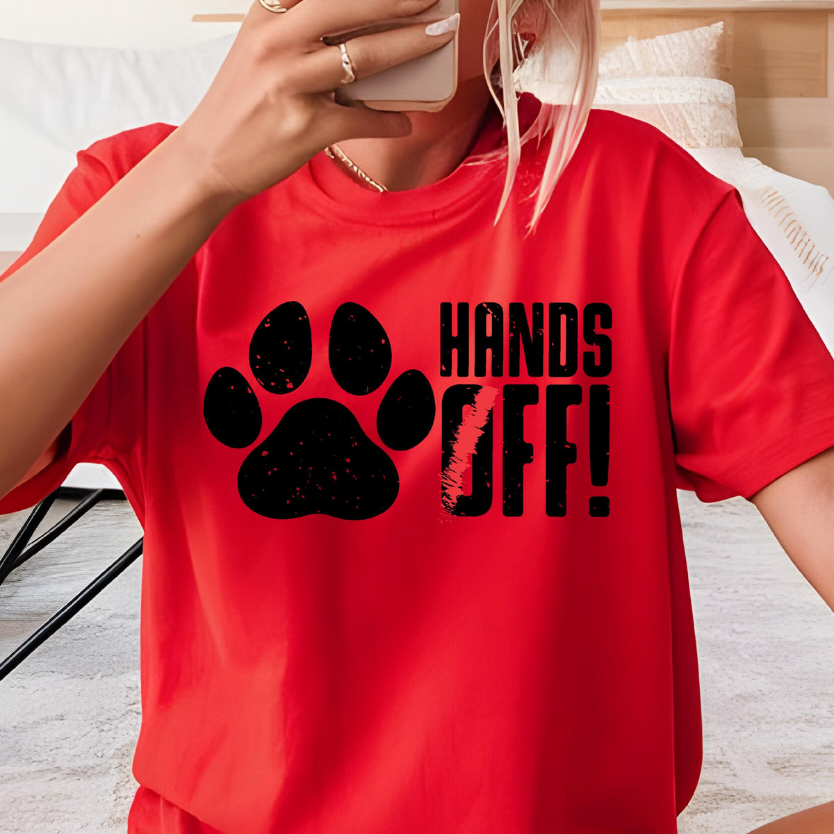 May include: Red t-shirt with a black paw print and the text "HANDS OFF!" printed on the front.