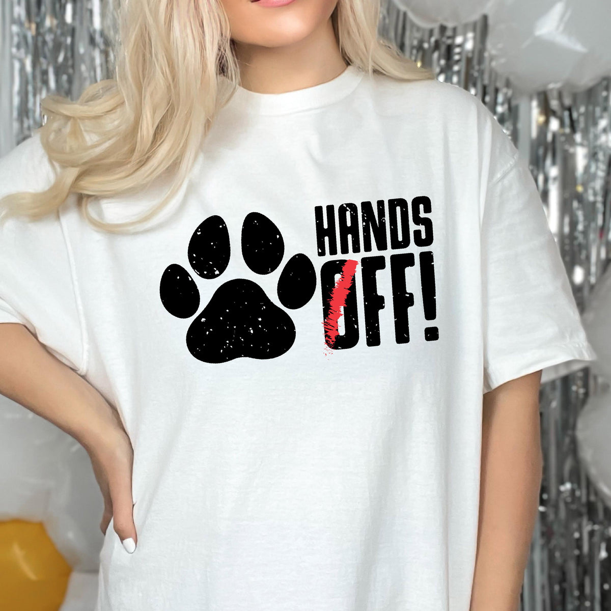May include: White t-shirt with a black paw print and the text "Hands Off!" in black letters.