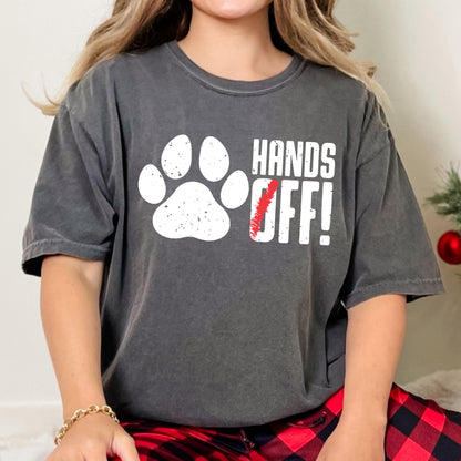 May include: A gray t-shirt with a white paw print and the text "HANDS OFF!" in white letters. The "O" in "OFF" is crossed out with a red line.