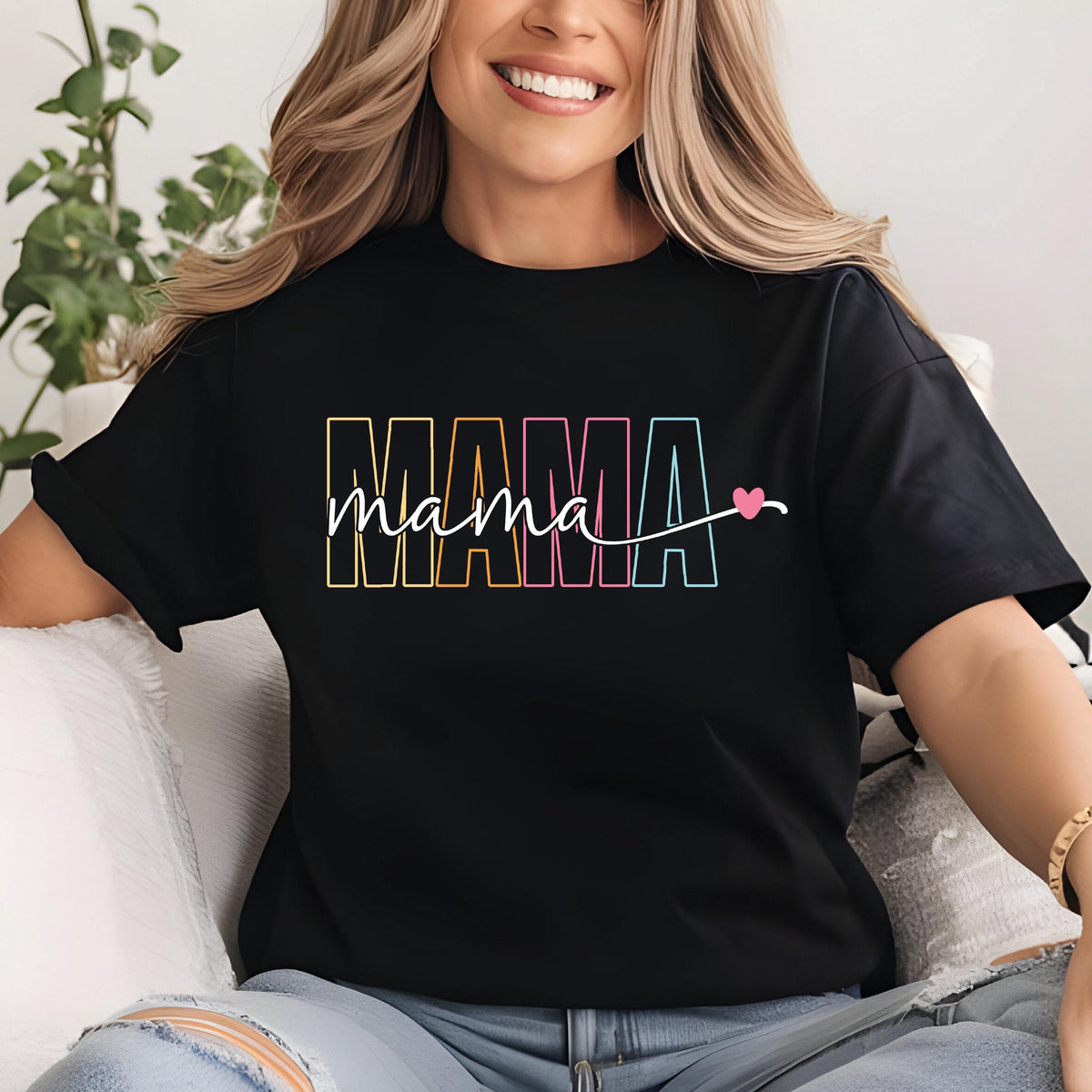 May include: Black t-shirt with a rainbow colored "MAMA" graphic and the word "mama" written in cursive with a pink heart.