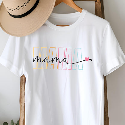 May include: White t-shirt with the word "MAMA" in rainbow colors and the word "mama" written in black script with a small pink heart.