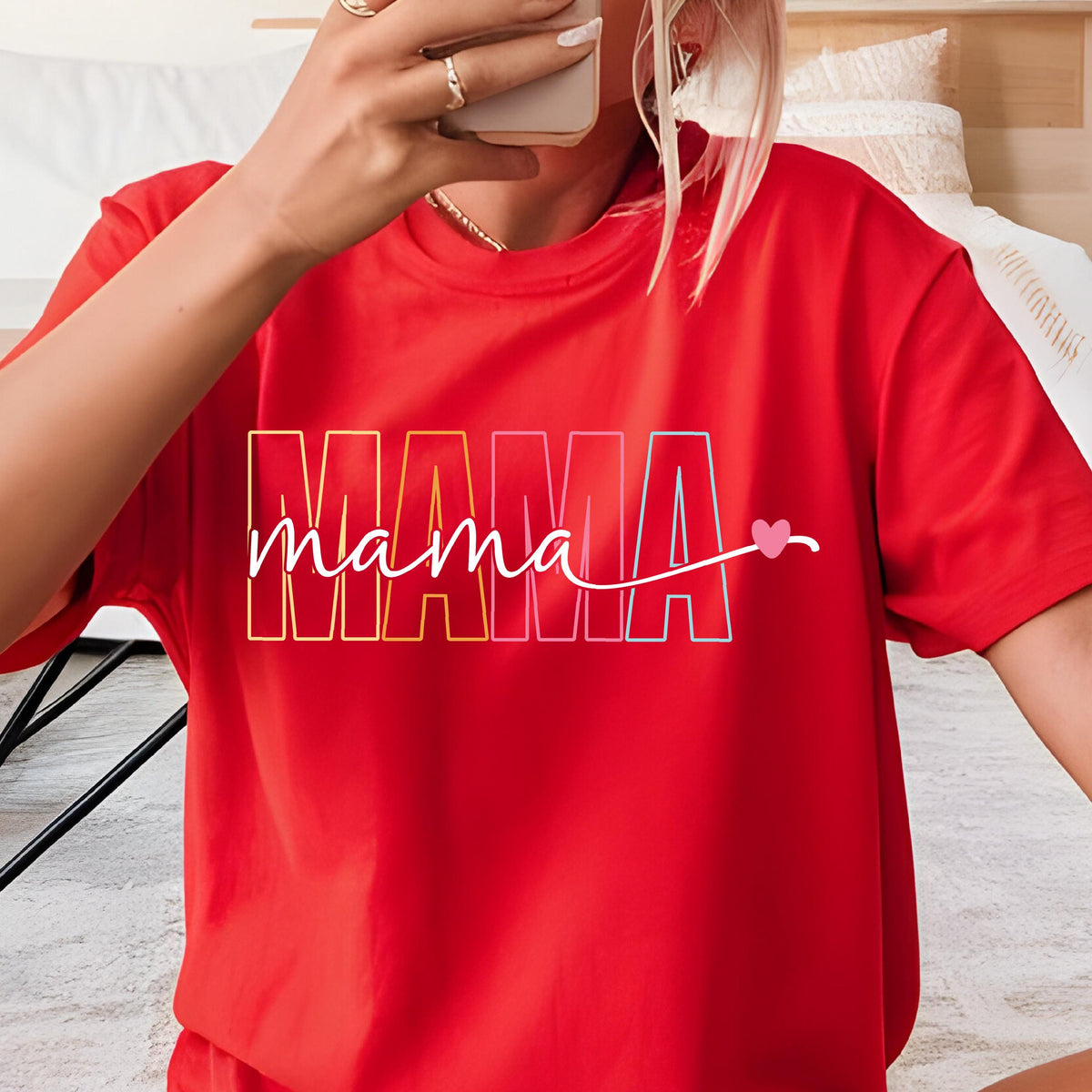 May include: Red t-shirt with a rainbow colored "MAMA" graphic and the word "mama" written in cursive with a pink heart.