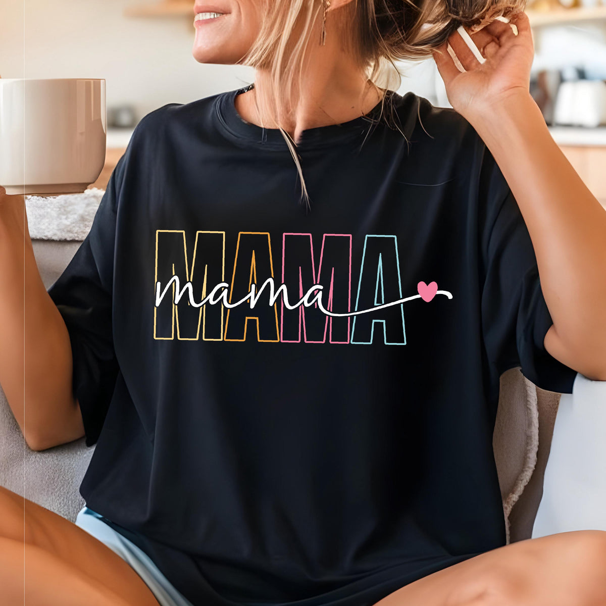 May include: Black t-shirt with a colorful "MAMA" graphic and the word "mama" written in cursive with a pink heart.