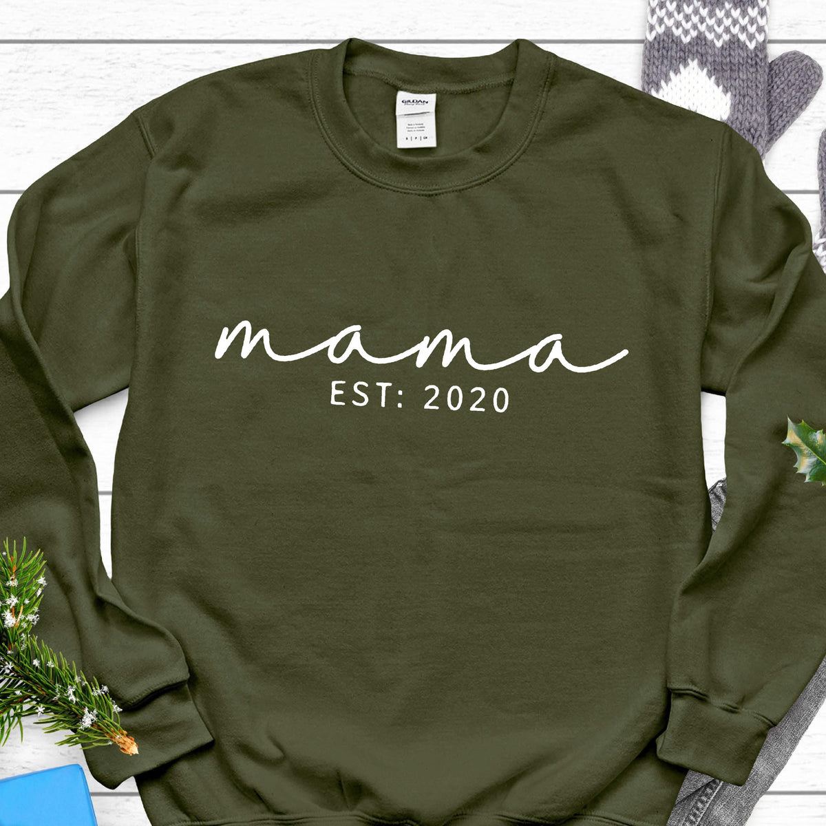 May include: A dark green sweatshirt with the text "mama est: 2020" in white.