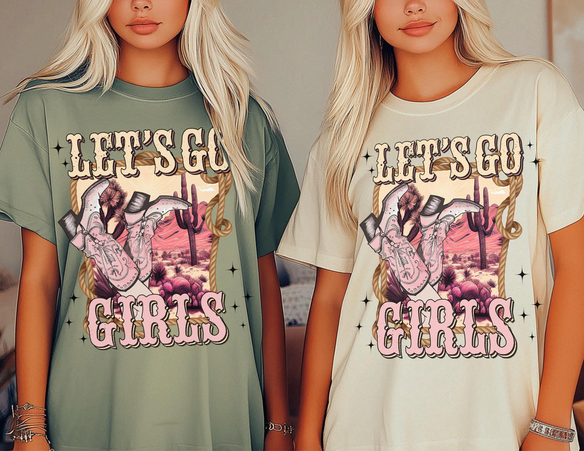 May include: Two women wearing t-shirts with a graphic print of cowboy boots, a cactus, and the text "Let's Go Girls".