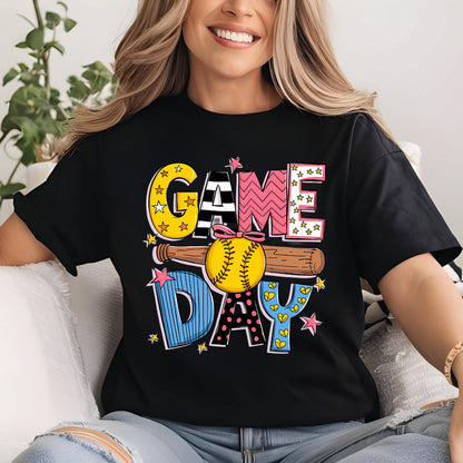 May include: Black t-shirt with a colorful graphic design that says "GAME DAY" with a baseball and bat. 