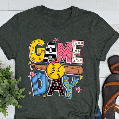 May include: A dark green t-shirt with the words "GAME DAY" in colorful, patterned letters. A softball and bat are featured in the design.
