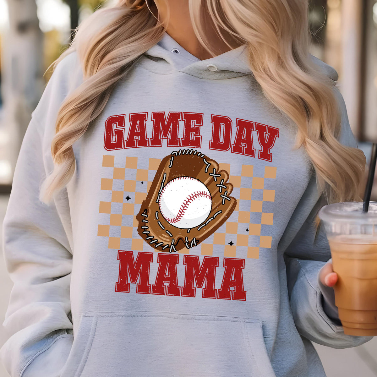 May include: A gray hooded sweatshirt with the text "GAME DAY MAMA" in red and white. A brown baseball glove with a white baseball is in the center of the text.
