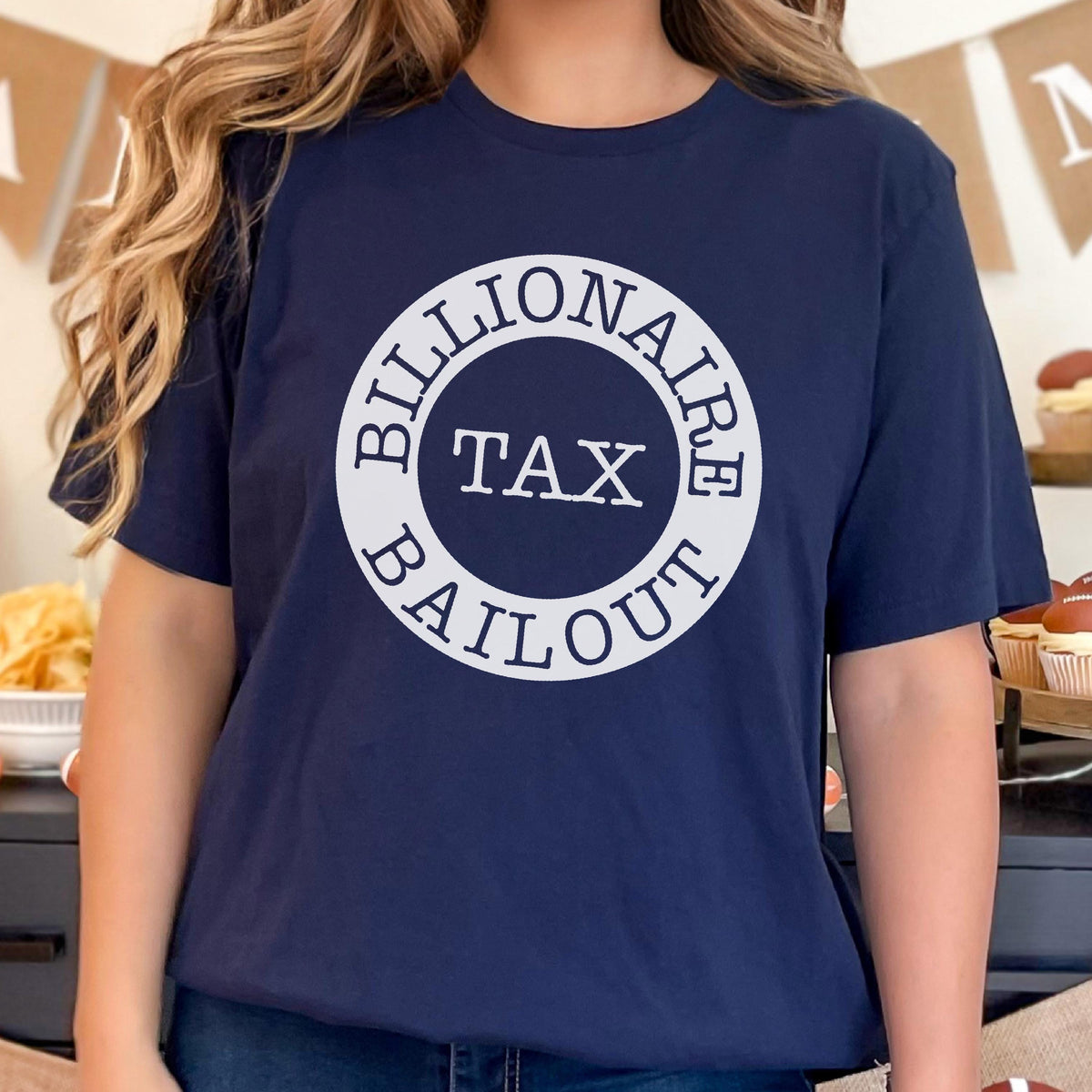 May include: A navy blue t-shirt with a white circle graphic that says "Billionaire Tax Bailout".
