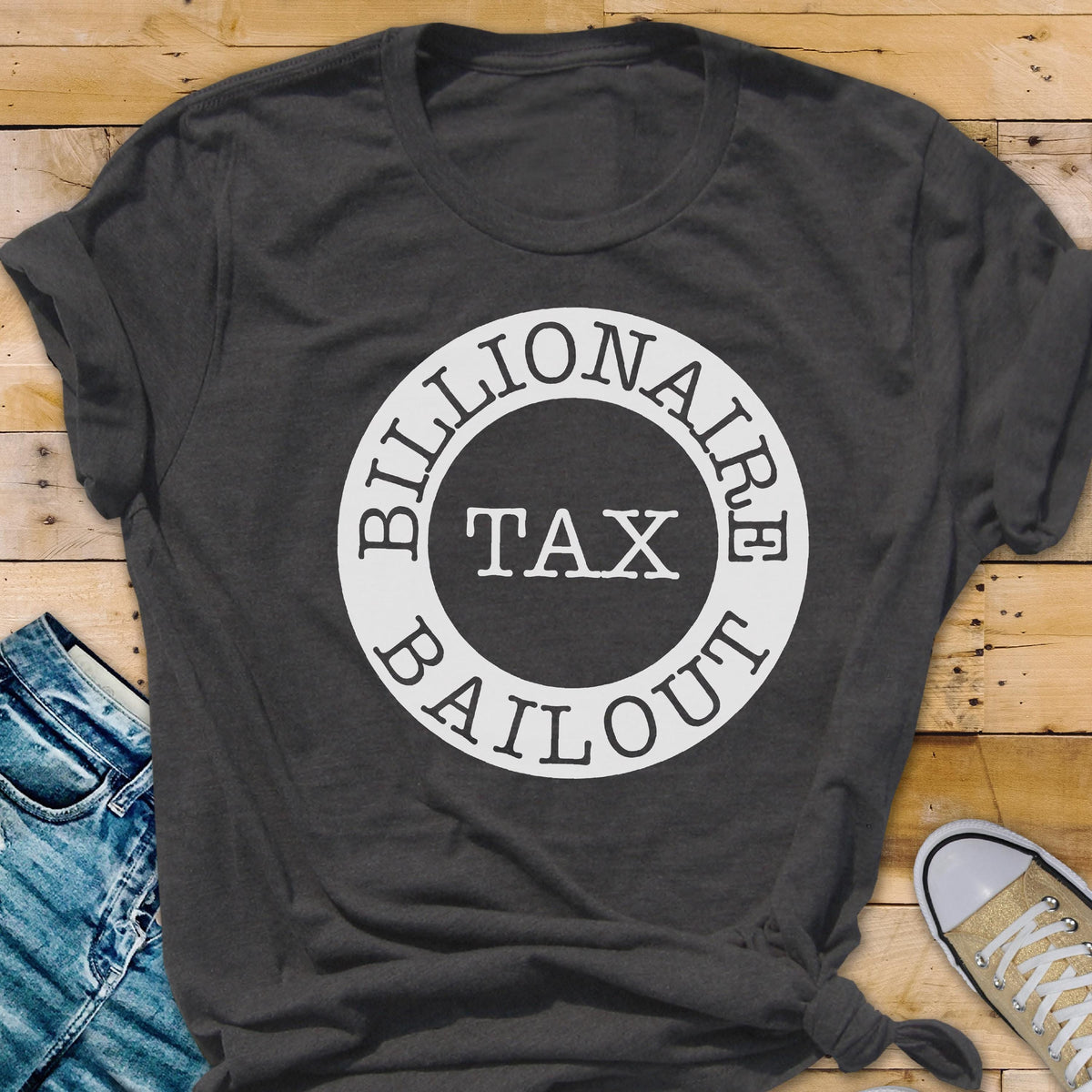 May include: A dark gray t-shirt with a white circle graphic that says "Billionaire Tax Bailout".