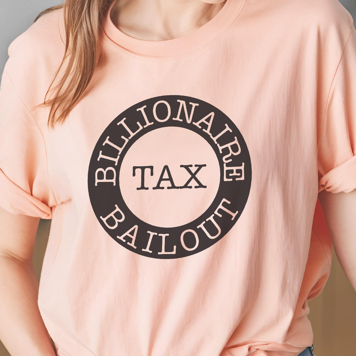 May include: A pink t-shirt with a black circle graphic that says "Billionaire Tax Bailout".