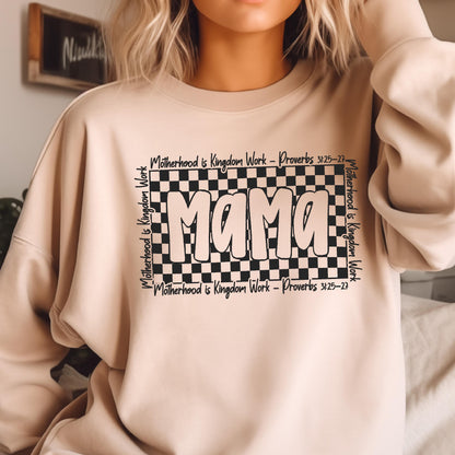May include: A beige sweatshirt with a black checkered design and the word "Mama" in a white outline. The text "Motherhood is Kingdom Work - Proverbs 3:25-27" is written around the checkered design.