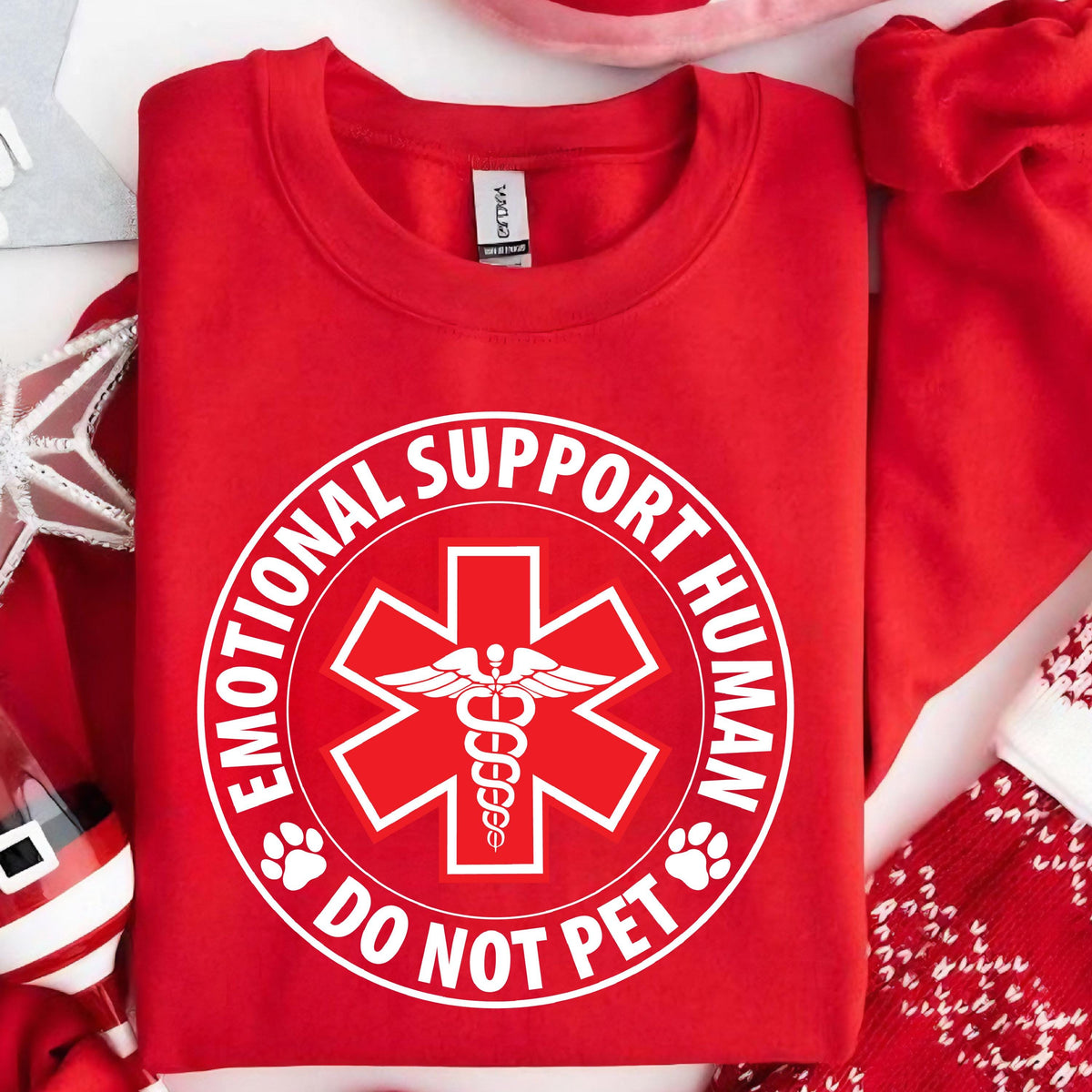 May include: Red sweatshirt with a white circle graphic that says "Emotional Support Human Do Not Pet" with a medical symbol inside the circle.