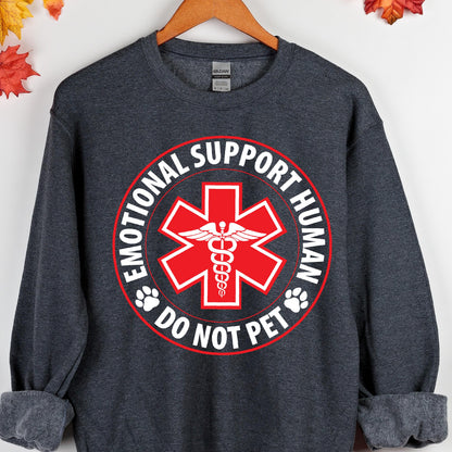 May include: A dark gray sweatshirt with a white circle graphic that says "Emotional Support Human" with a red medical symbol and the words "Do Not Pet" in the center.