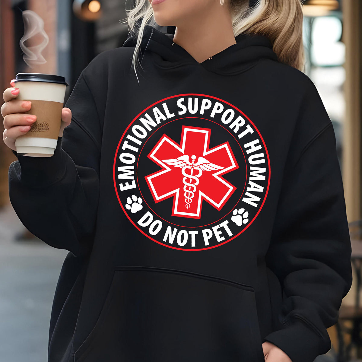 May include: Black hoodie with a white circle graphic that says "Emotional Support Human Do Not Pet" with a red medical symbol in the center.