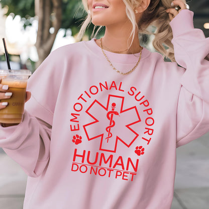May include: Pink sweatshirt with a red graphic of a medical symbol with a snake and the text "Emotional Support Human Do Not Pet" around it.