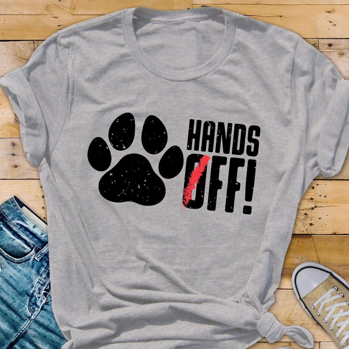 May include: Gray t-shirt with a black paw print and the text "HANDS OFF!" in black.