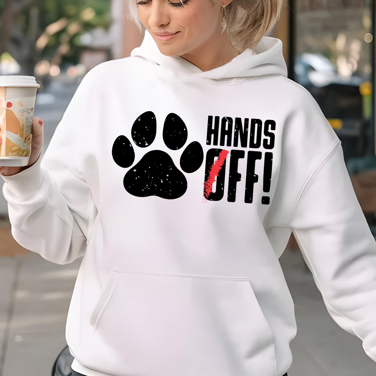 May include: White hoodie with a black paw print and the text "Hands Off!" in black and red.