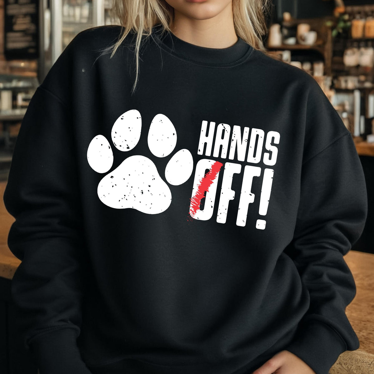 May include: Black sweatshirt with a white paw print and the text "HANDS OFF!" in white.