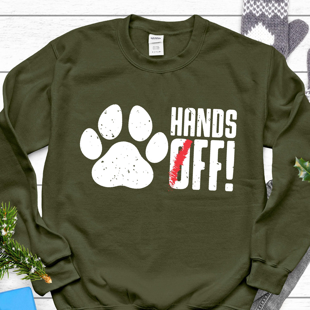 May include: A green sweatshirt with a white paw print and the text "HANDS OFF!" in white letters.
