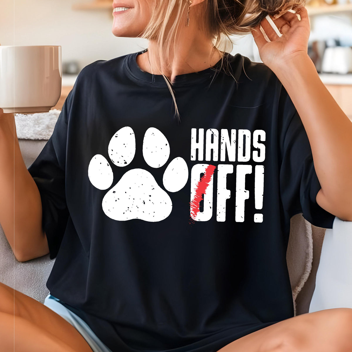 May include: Black t-shirt with a white paw print and the text "Hands Off!" in white letters.