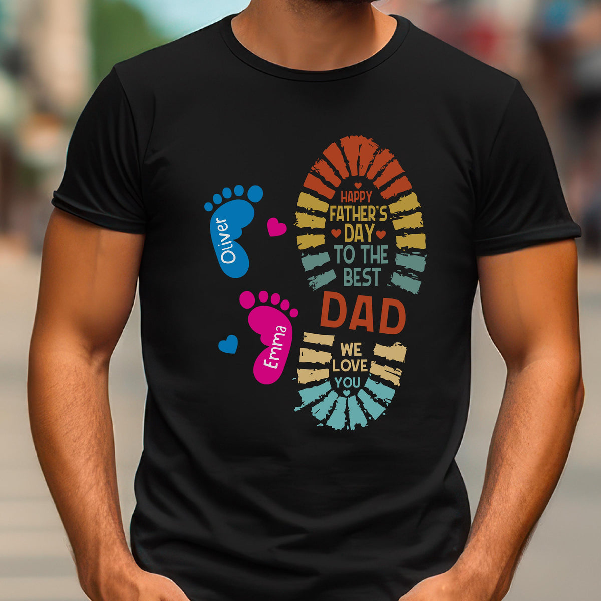 May include: Black t-shirt with a colorful graphic for Father's Day. The design includes a footprint, hearts, and the text "Happy Father's Day to the Best Dad." The names "Oliver" and "Emma" are also included.