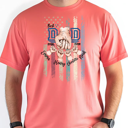 May include: Coral-colored t-shirt with a graphic design. The design features the words "Best Dad Ever" above a depiction of a hand clenching other smaller hands, with the names "Emma", "Henry", "Charlotte", and "Noah" below.