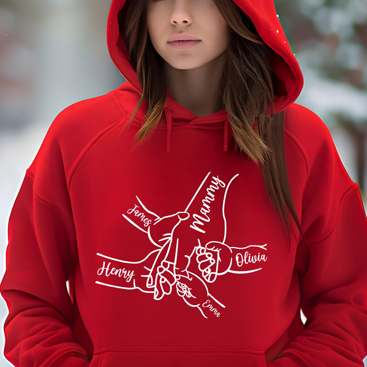 May include: A red hooded sweatshirt featuring a white graphic of hands holding each other, with the names "James", "Henry", "Olivia", "Emma", and "Mammy" in a script font. The sweatshirt has a drawstring hood.