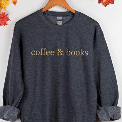 May include: A dark gray sweatshirt with the text "coffee & books" printed in gold on the front.