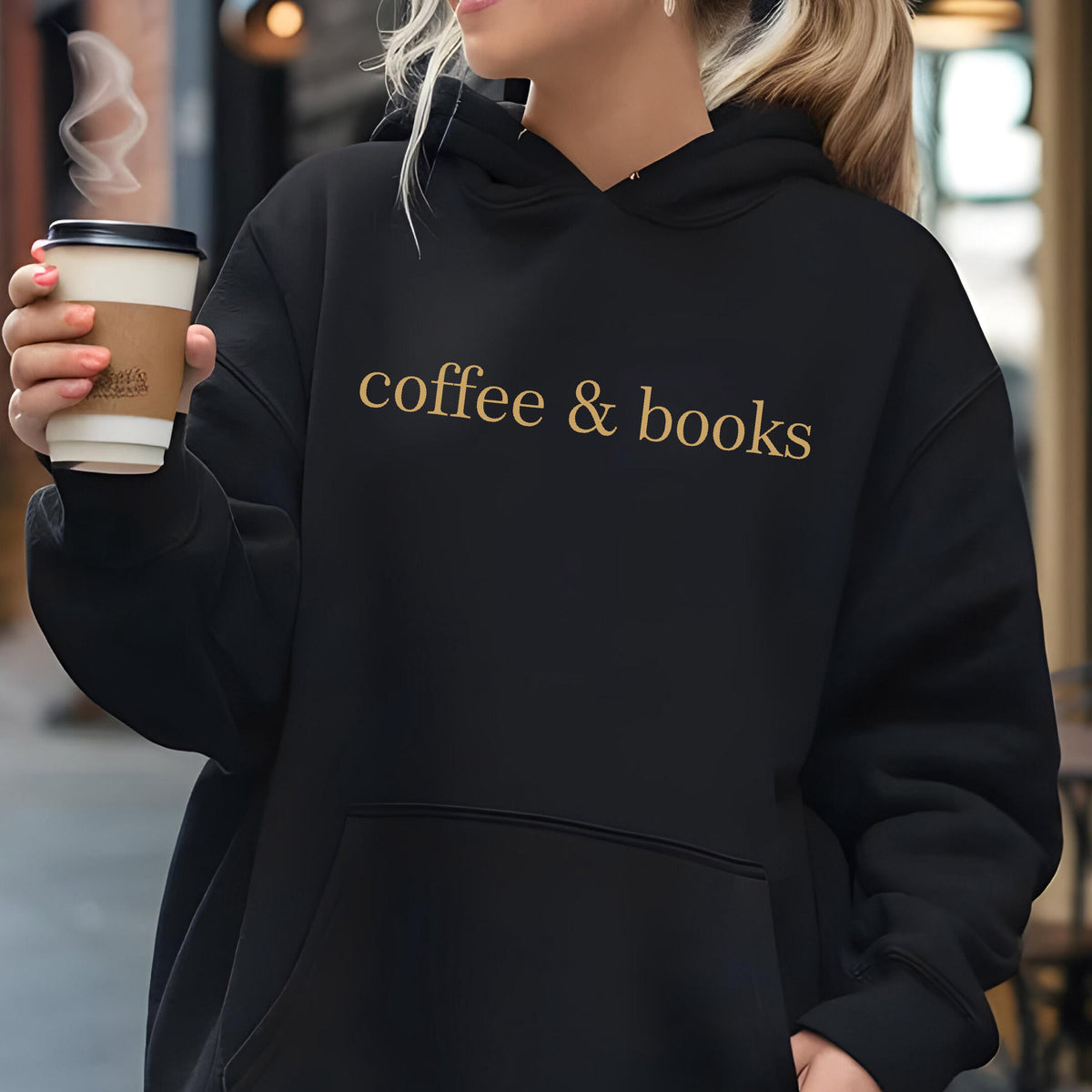 May include: Black hoodie with a gold inscription that reads "coffee & books".