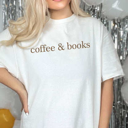 May include: White t-shirt with the text "coffee & books" printed in brown on the front.