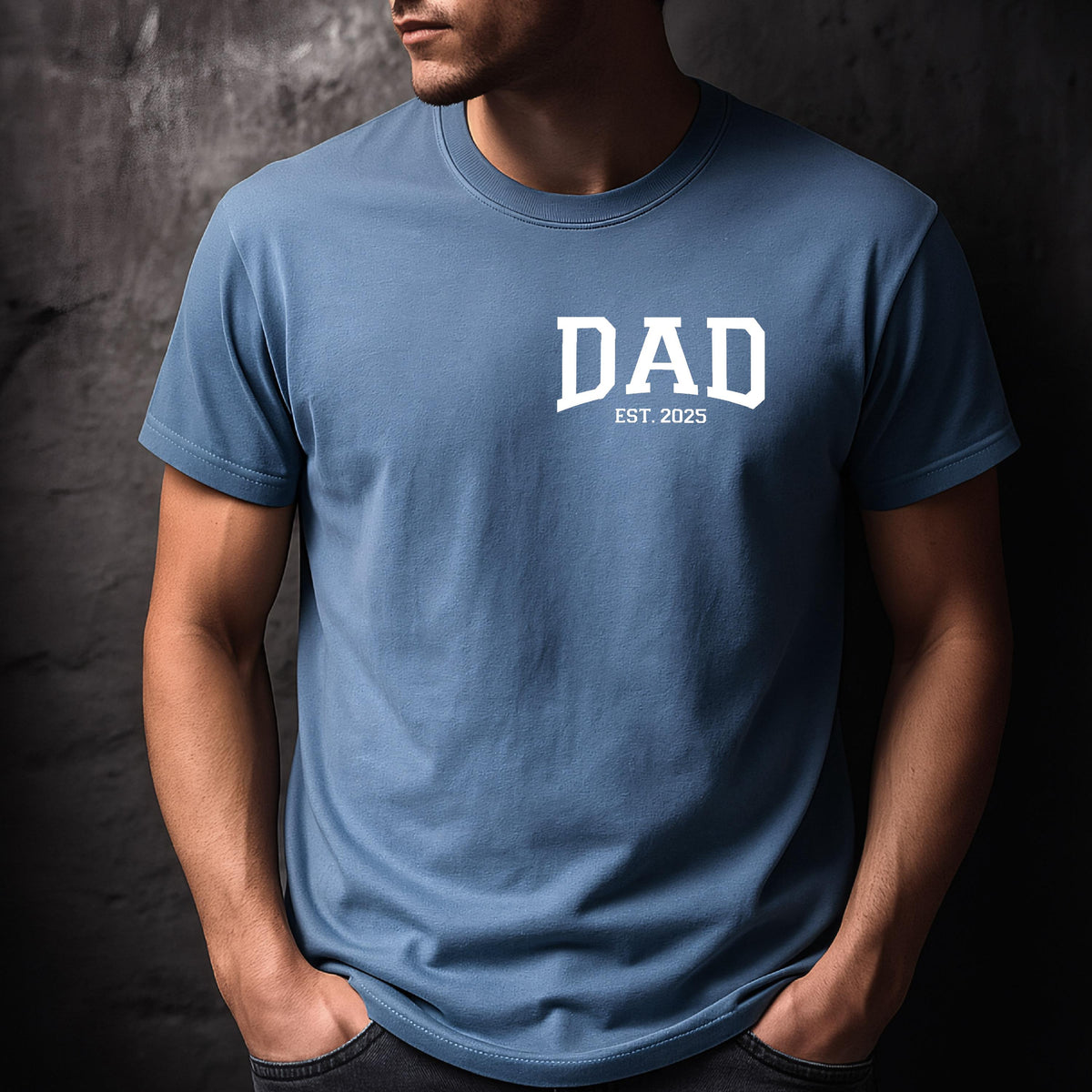May include: A blue t-shirt with white text that reads "DAD EST. 2025".