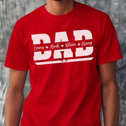 May include: Red t-shirt with the word "DAD" in large white block letters. Below the word "DAD" are the names Emma, Noah, Olivia, and Henry, each with a heart symbol. A star is below the word "DAD".