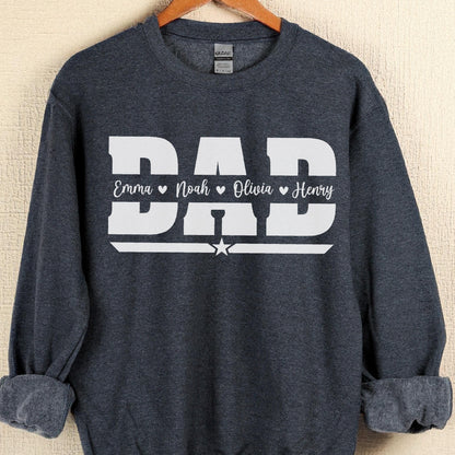 May include: A dark gray sweatshirt with the word "DAD" in large white block letters. Below the word "DAD" are the names "Emma", "Noah", "Olivia", and "Henry" in white script. A white star is below the word "DAD".