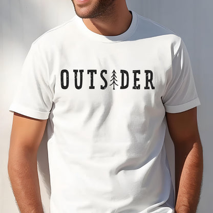 May include: A white short-sleeved t-shirt featuring the black text OUTSIDER printed across the chest. The letter I in the word is replaced by a stylized graphic of a pine tree. The font has a slightly distressed, textured appearance.
