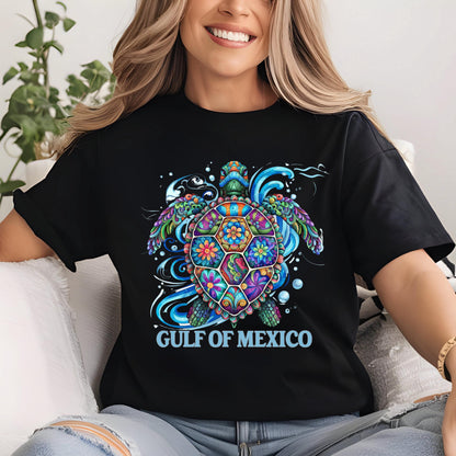 May include: Black t-shirt with a colorful, floral patterned sea turtle design and the text "GULF OF MEXICO" in blue.