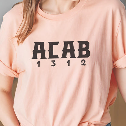 May include: A pink t-shirt with the text "ACAB 1312" printed in black.
