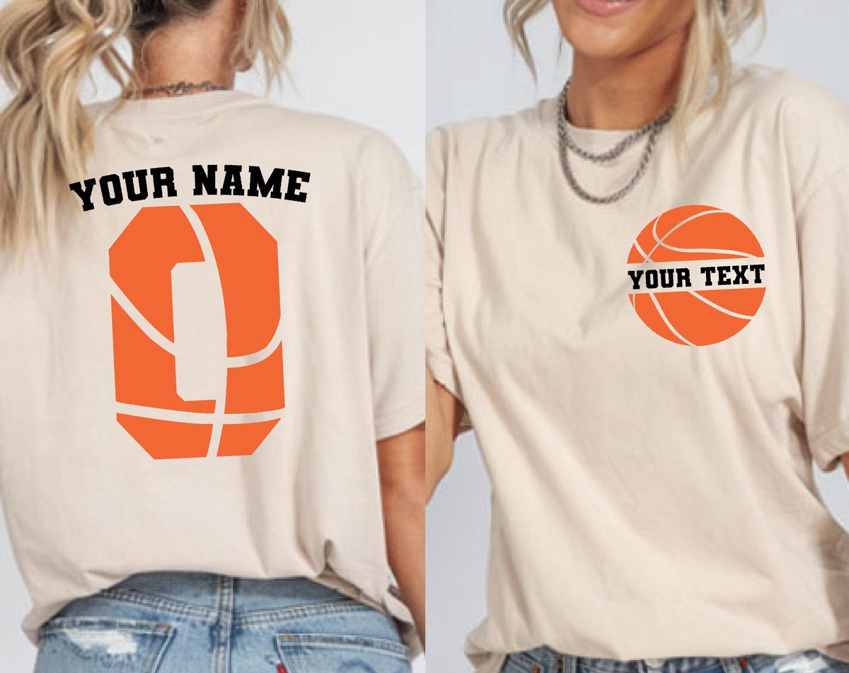 May include: A beige t-shirt featuring a basketball-themed design. The back displays a large orange basketball graphic shaped like the letter O with the text YOUR NAME above it. The front features a smaller basketball graphic with YOUR TEXT.