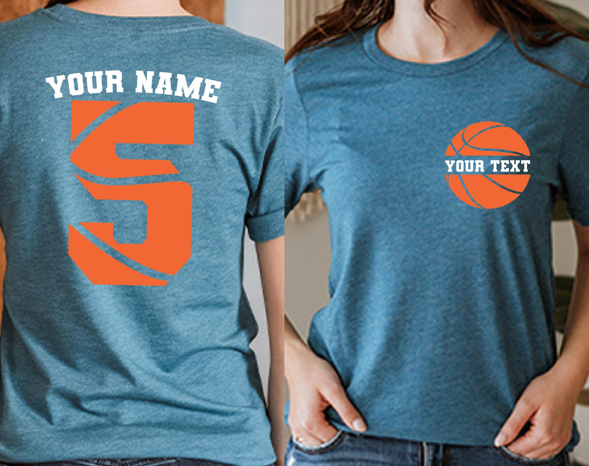 May include: A heathered blue t-shirt featuring a large orange letter S with basketball line details and the text YOUR NAME on the back, and a small orange basketball graphic with the text YOUR TEXT on the front left chest area.