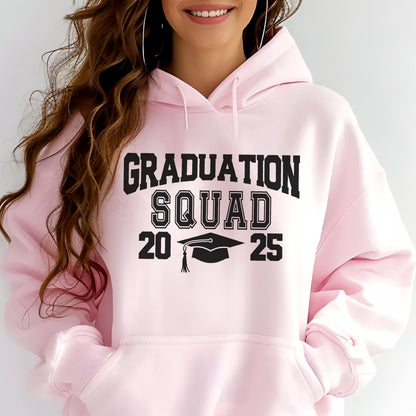 May include: A light pink hooded sweatshirt with the words "GRADUATION SQUAD" in black block letters. Below the text are the numbers "20" and "25" with a graduation cap graphic in between. The sweatshirt has a front pocket and long sleeves.