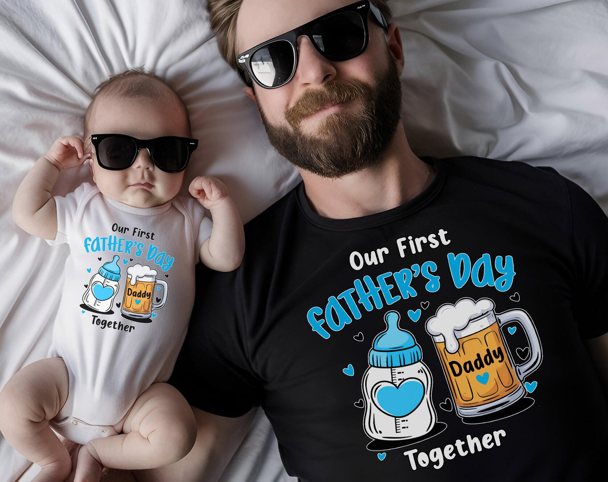 May include: A baby wearing sunglasses and a white onesie with the text "Our First Father's Day Together" and a matching black t-shirt. The shirt and onesie feature a baby bottle and beer mug graphic.