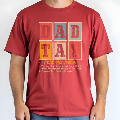 May include: A maroon t-shirt with the words "DAD TAX" in a retro, block-letter design. The shirt includes a definition of "DAD TAX" below the text, with two humorous points about a father's spending habits.
